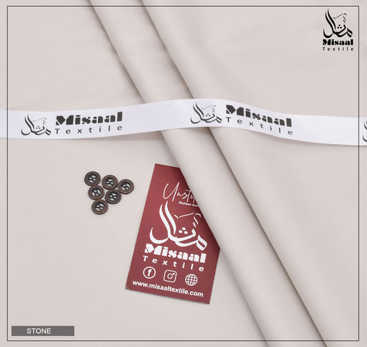 Misaal Textile fabric with buttons and a tag on a neutral background