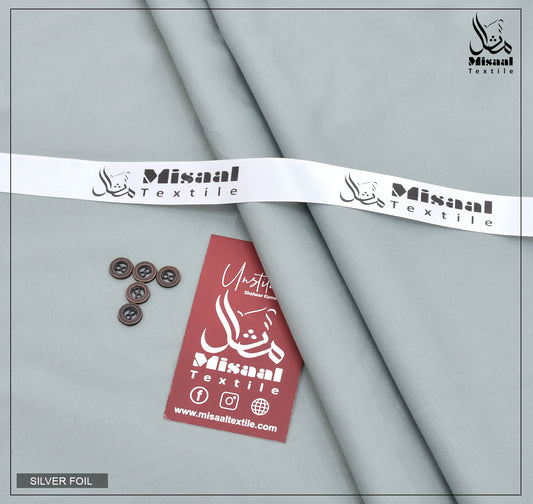 Gray fabric with silver foil, buttons, and a red tag with 'Misaal Textile' branding on a gray background.