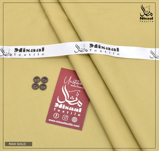 Raw gold fabric with Misaal Textile branding on a beige background