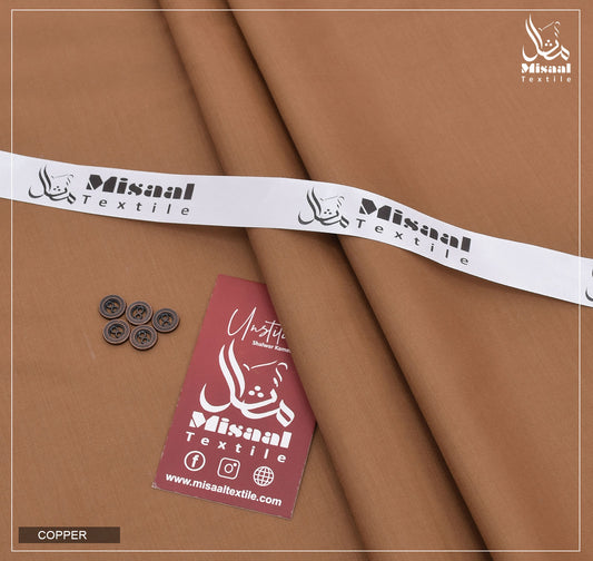 Brown fabric with Misaal Textile branding, buttons, and a tag on a brown background.